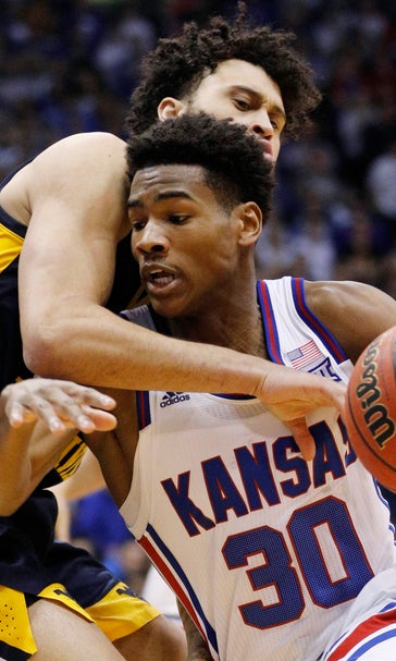 Dotson, Lawson brothers lead No. 14 Kansas’ rout of WVU